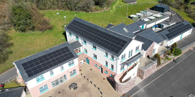 Sun setting over commercial solar panels ireland