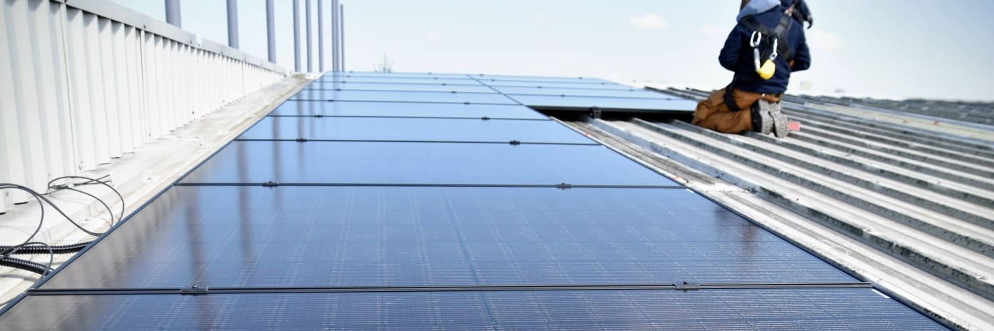 Solar Panel Installers on Roof of an Irish business
