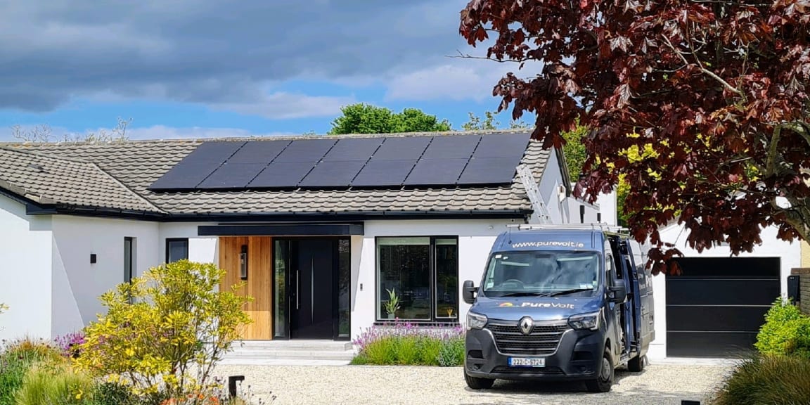 Solar panels on roof, with Purevolt EV parked in the driveway