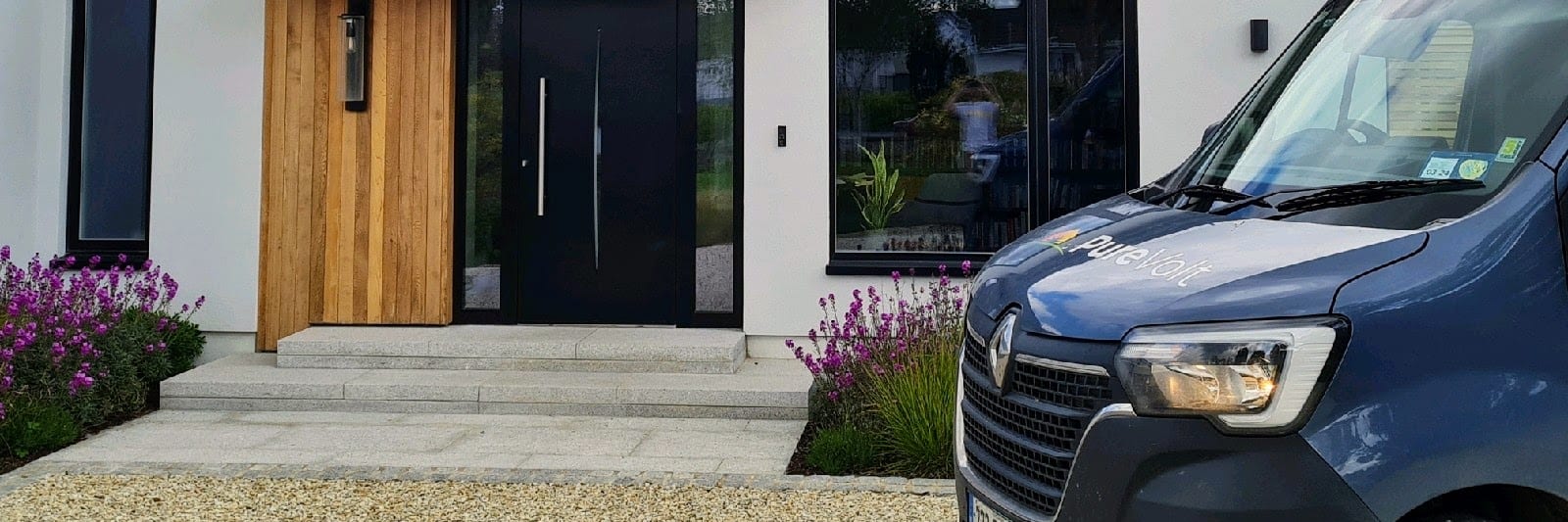 Solar panels on a house with an electric vehicle