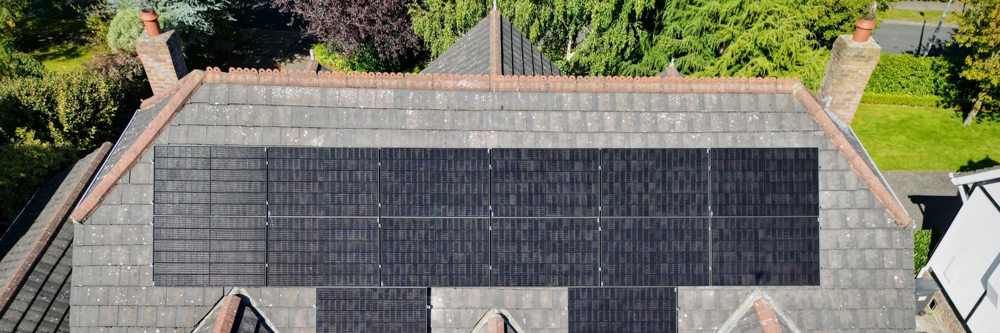 Solar panels on a house with an electric vehicle