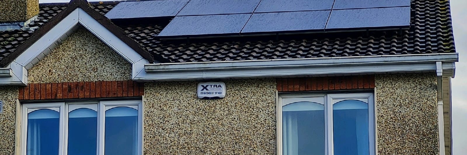 Solar panels on house in Ireland overlooking the sea