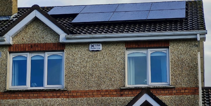 Solar panels on house in Ireland overlooking the sea