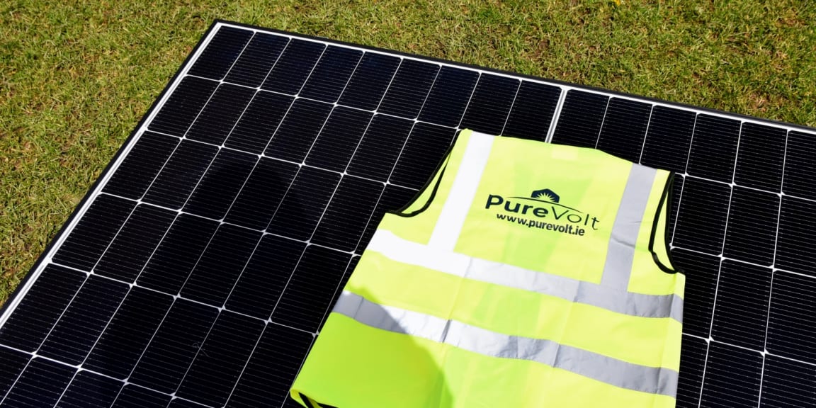 Purevolt Solar hi-vis jacket on solar panel