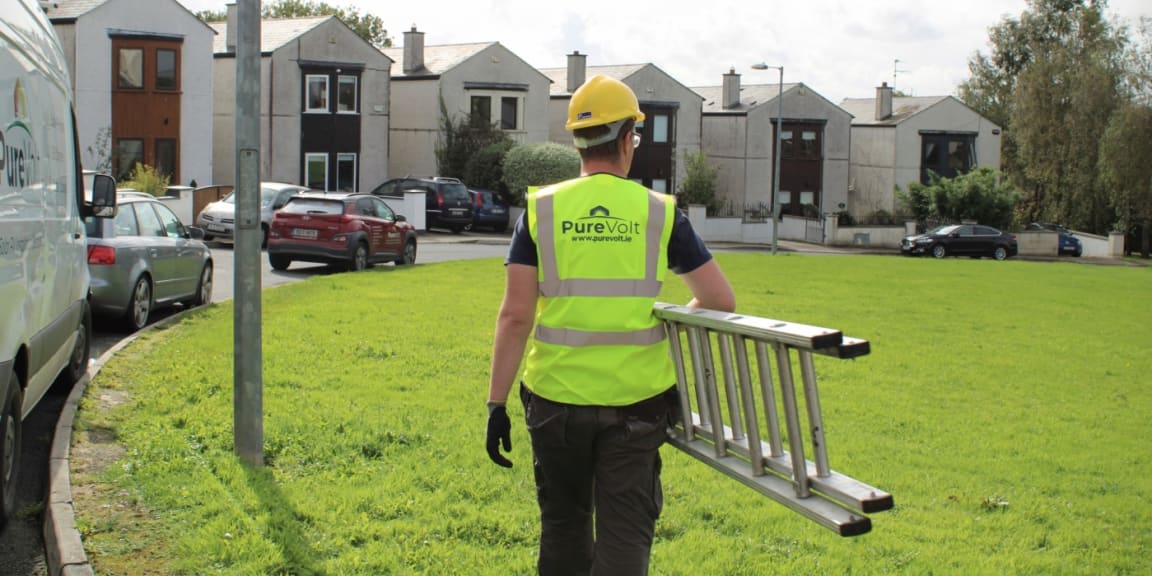 Purevolt Solar staff member holding a ladder