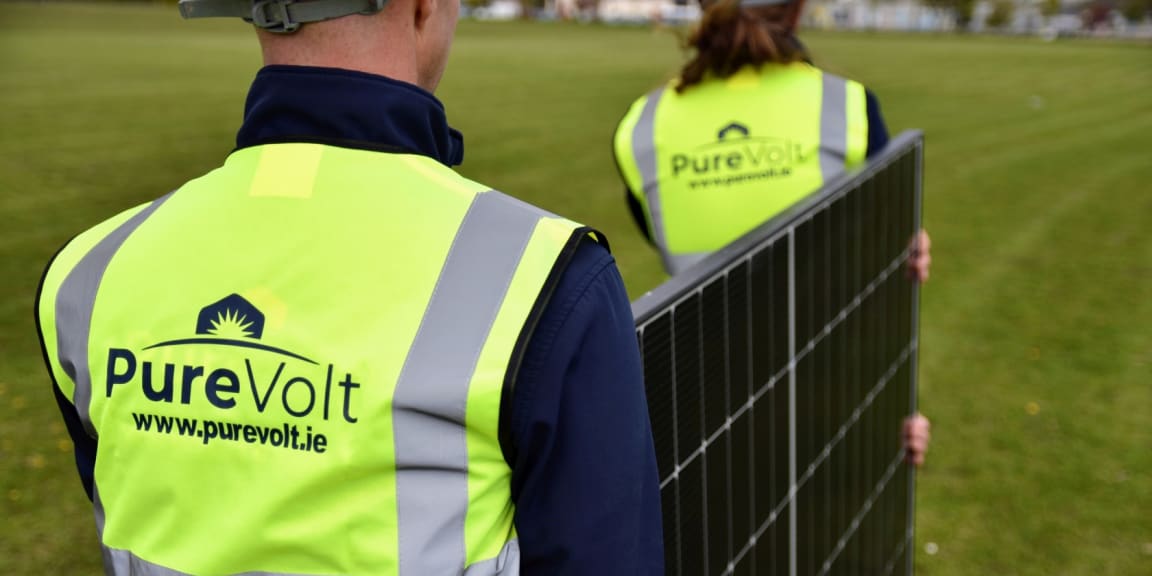 Purevolt Solar team carrying solar panel