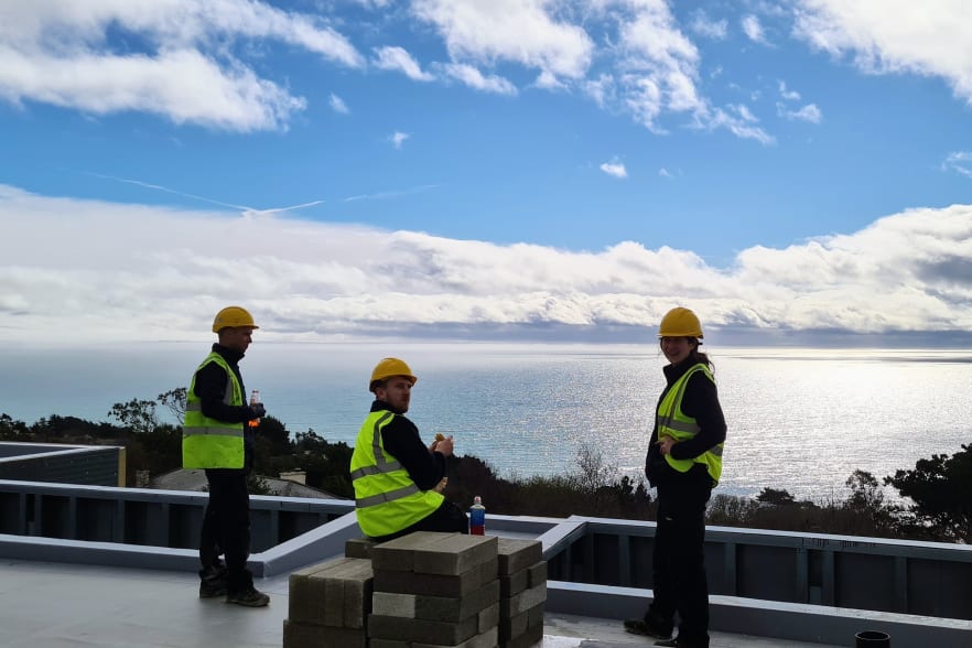 PureVolt Solar Team on a flat roof